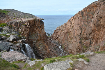 The Barents Sea and Teriberka Waterfall. Arctic, Russia.