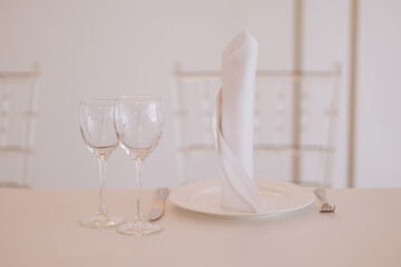 Three empty glasses for alcoholic beverages of vodka, wine and champagne are on the table. High quality photo