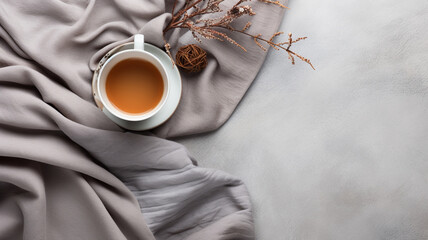 cup of hot coffee and a white scarf. top view. flat lay.