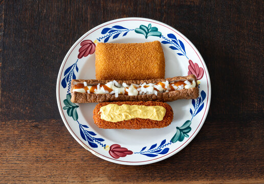 Traditional dutch fast food snacks, Kaassouffle, Frikandel Speciaal and Kroket
