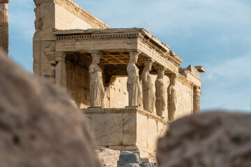 Caryatids statues at Erechtheion temple in Acropolis of Athens, Greece. Erechtheum is an ancient...