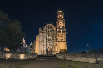 Temple of San Francisco Javier in the magical town of Tepotzotl&aacute;n at night with its lighting, with the stars behind, with baroque architecture.