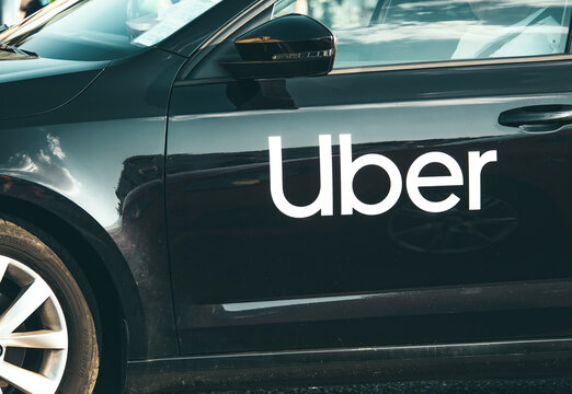 Bucharest, Romania -July 01 2023 : Car with the logo of the ride hailing company Uber in traffic.