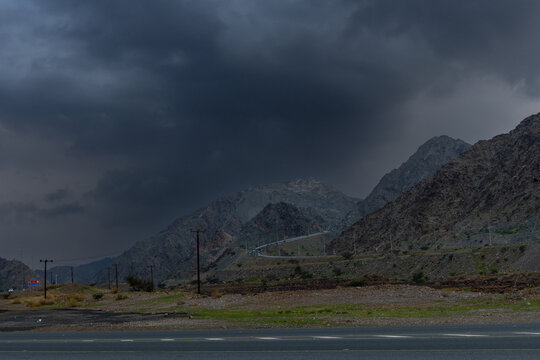 Fujairah Drive: A Car Adventure with Masafi Mountains in the Background Highway Views: Scenic Drive Behind the Majestic Masafi Mountains