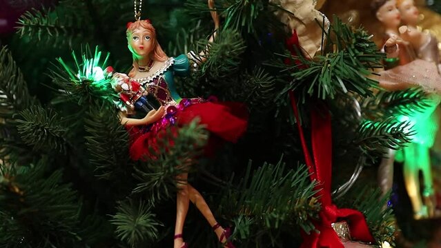 Christmas tree with decorations, figures of ballerinas.