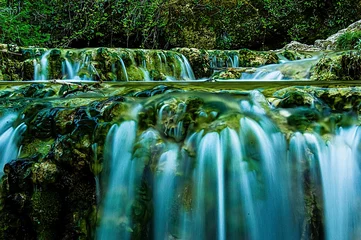 Fotobehang silk effect in a waterfall © javier