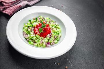salad vegetable cucumber, tomato fresh vegetables healthy eating cooking appetizer meal food snack on the table copy space food background rustic top view