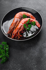 shrimp gambas langoustine large  prawn eating cooking meal food snack on the table copy space food background rustic top view 