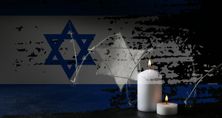 Double exposure of flag of Israel, burning candles, barbed wire and David star on black background....