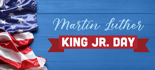 Fototapeta na wymiar Banner for Martin Luther King Jr. Day with USA flag on blue wooden background