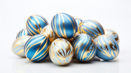 Easter eggs decorated with blue and gold patterns on a white background.