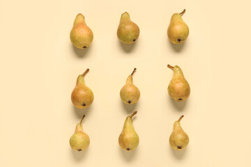 Ripe pears on yellow background