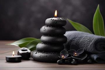 Tuinposter Spa Spa stones with towels and candles on wooden background