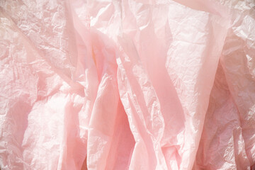 deep rose colored crumpled paper texture background for design, decorative. rumpled recycle paper...