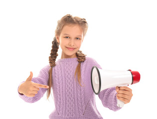 Naklejka premium Little girl pointing at megaphone on white background