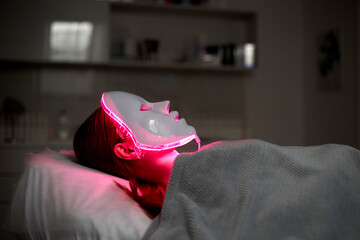 Photodynamic therapy. Cosmetic face mask. the girl is wearing a mask. Health and beauty.