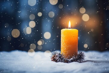 Advent candle with snow and bokeh.	