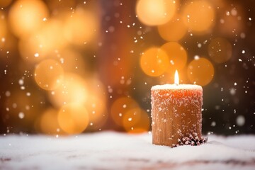 Advent candle with snow and bokeh.	