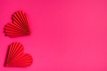 Two beautiful hearts on a pink background, symbol of love, happy woman, mother, Valentine's Day, greeting card design.