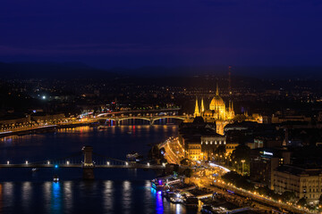 Picturesque evening Budapest  cityscape at blue hour with illuminated Chain Bridge and Hungarian Parliament on Danube River.