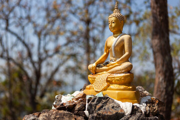 Buddha image at the top of Doi Nang Mo mountain near Chiang Mai, Northern Thailand.