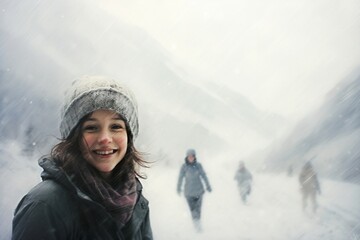 Fototapeta na wymiar Mountain Magic: Laughter and Snowfall Create a Family Wonderland