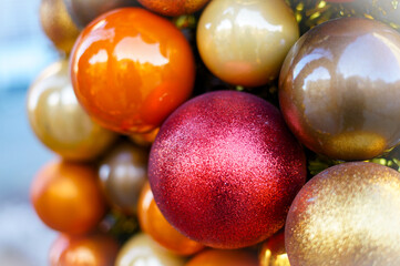 Fototapeta na wymiar Red orange and golden christmas balls.