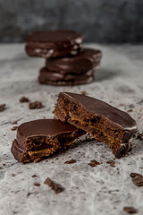 chocolate and dulce de leche alfajor gray background