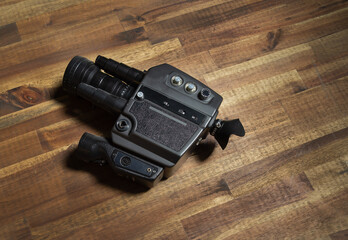 Camera Super 8 on wooden table , nice light 