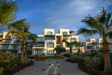 Fototapeta na wymiar complex with white villas on the Mediterranean Sea 1