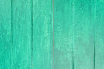 A full frame of turquoise wooden planks, their brush strokes adding texture and character to the...