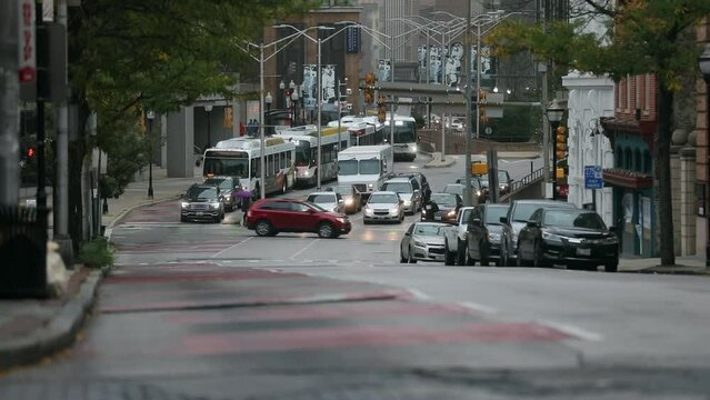 Baltimore Traffic and MTA Bus in Background. Buses are operated by the Maryland Transit Administration. Maryland State
