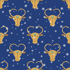 Seamless animal winter pattern with stylized horned heads of a bull or cow and snowflakes. Seasonal Christmas print. Ethnic design from Altyndepe, Turkmenistan. On blue background.