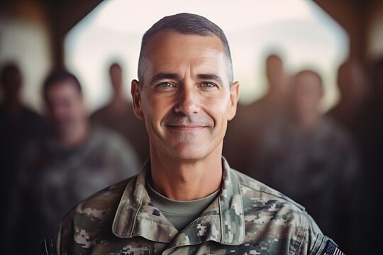 Portrait Of A Smiling Soldier Standing In Front Of A Group Of Soldiers