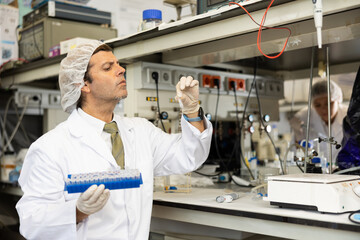 Skilled male technical expert provide analysis service in modern science research laboratory,...