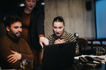 Business team working late, analyzing data for revenue growth and a strong sales strategy.