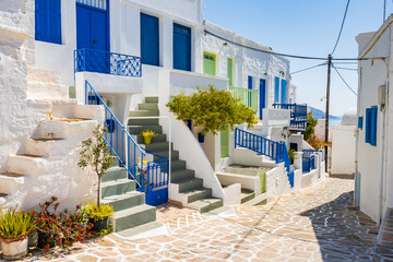 Narrow streets with typical Greek style architecture in Kimolos village, Kimolos island, Cyclades, Greece - 692234126