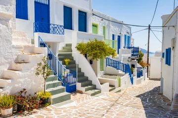  Narrow streets with typical Greek style architecture in Kimolos village, Kimolos island, Cyclades, Greece © pkazmierczak