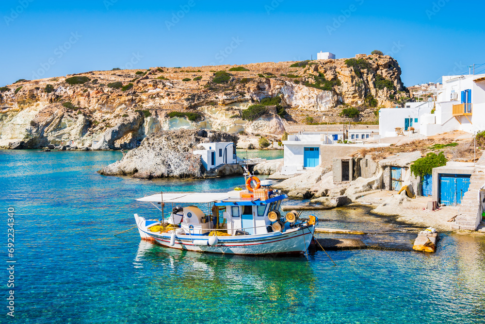 Wall mural fishing boat at rema beach in beautiful sea bay, kimolos island, cyclades, greece