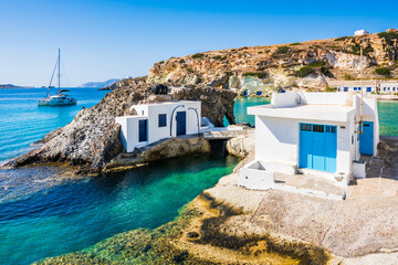 Fishermen houses near Rema beach in beautiful sea bay, Kimolos island, Cyclades, Greece
