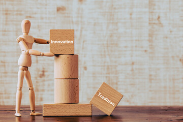 There is wood cube with the word Innovation or Tradition. It is as an eye-catching image.