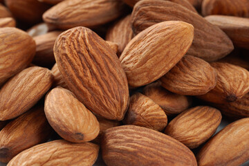 Dried almonds. Almond background. Heap of dry nuts close-up