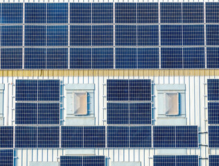 Fototapeta premium aerial view close up macro of solar panels in full sun on a roof