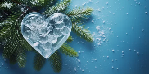 Fotobehang heart shaped christmas tree, A snow covered background with a blue background, A tree with bubbles and the word  on it, Frozen drop of water ice faded moment symbol, Snowflakes at a window in the form © Saim