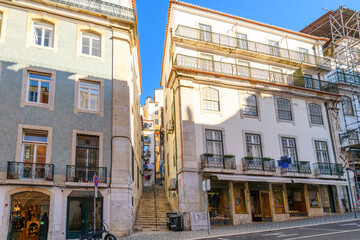 A narrow steep staircase leading to the Alfama district in the historic center of Lisbon Portugal.