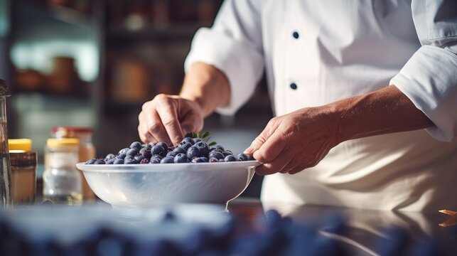 Culinary Artistry: A Close-Up of a Chef Preparing Blueberries in a Professional Kitchen