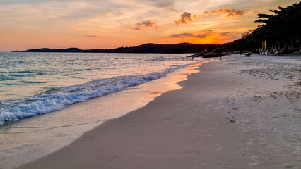 sunset on the beach of Koh Samet Island Rayong Thailand, the white tropical beach of Samed Island with a turqouse colored ocean