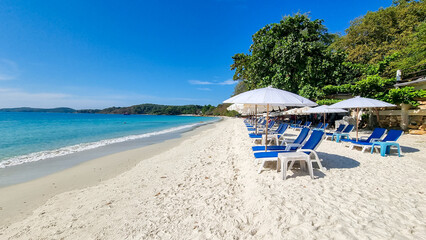 Koh Samet Island Rayong Thailand, beach chairs sunbed with umbrellas at the white tropical beach of...