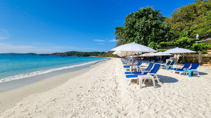 Koh Samet Island Rayong Thailand, beach chairs sunbed with umbrellas at the white tropical beach of Samed Island 