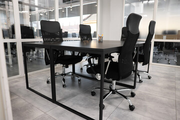Comfortable office chairs and tables in meeting room
